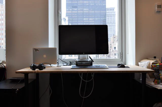 Workstation with monitor and MacBook